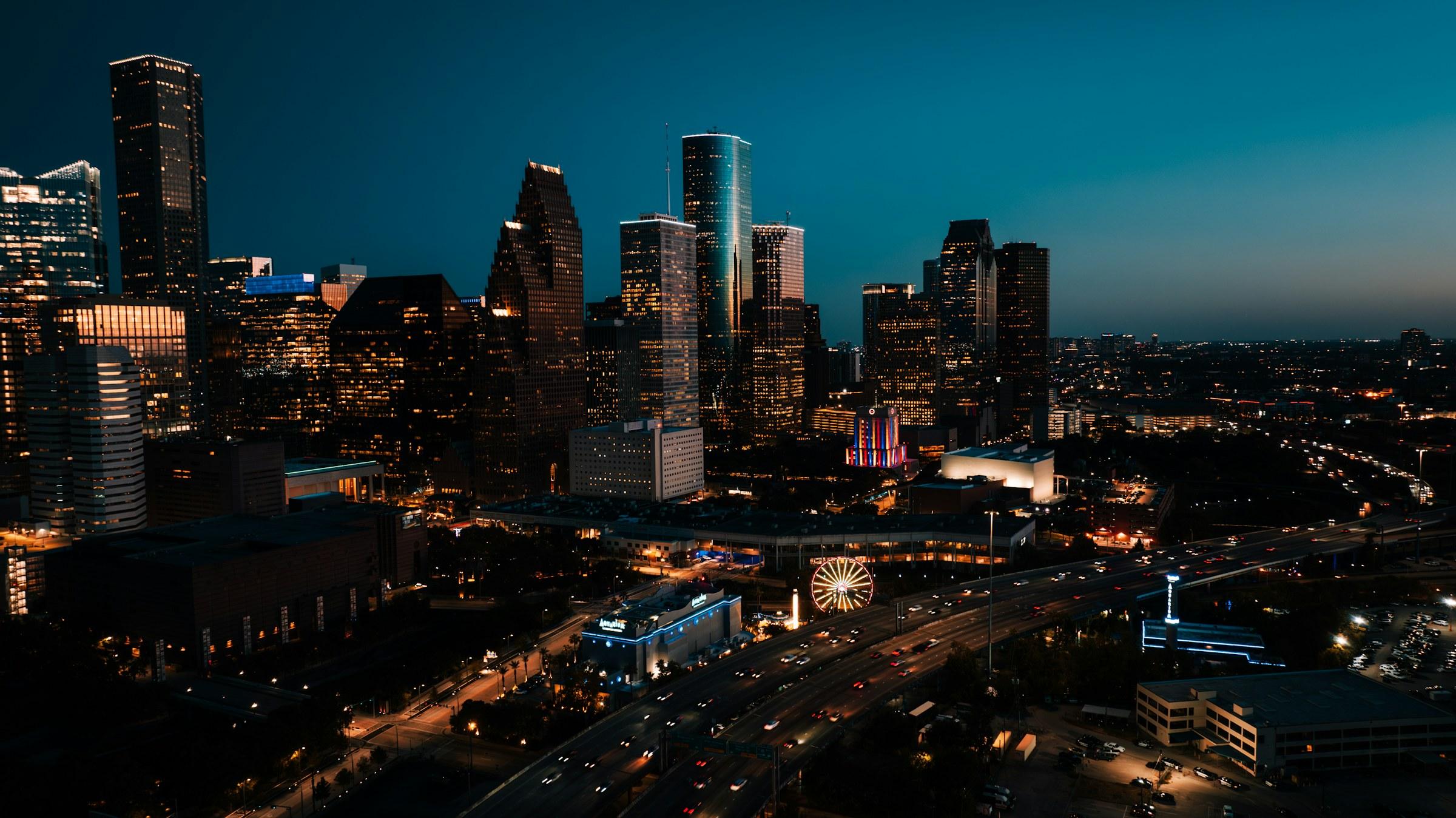 Downtown Houston skyline at night, seen from the northwest with the Pierce Elevated freeway in the foreground